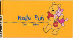 Nalle Puhs klokbok 2004 omslag serier